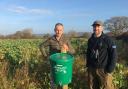 Antony Griffith (left) of Tŷ Newydd Farm, and Matt Goodall of the GWCT pictured with the feeding bucket and cover crop.