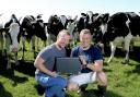 Gareth and Sion Roberts at home on the farm with their NFU Cymru/NFU Mutual Award. Picture: Peter Williams