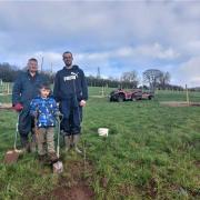Jesse Davies and Tom and Mat Feakins plant the orchard.