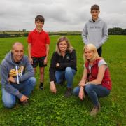 Edward and Kate Jones and their sons, Rees and Harry, are pictured with Farming Connect red meat technical officer, Lisa Roberts. Picture: Farming Connect