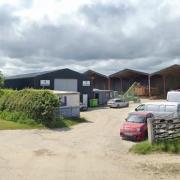 The Gaer farm, Golfa where retrospective plans to change the use of buildings to house log cabin construction business and adjoining sawmill have been  withdrawn.