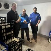 James Durose, of Raglan Dairy, right, showing David Davies MP and Cllr Richard John, centre, around his dairy that will no longer be used to supply Monmouthshire County Council.