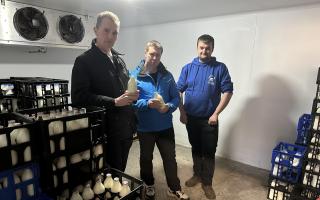 James Durose, of Raglan Dairy, right, showing David Davies MP and Cllr Richard John, centre, around his dairy that will no longer be used to supply Monmouthshire County Council.