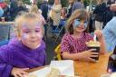 Freya and Elen Williams tuck into some seriously good food at Narberth Food Festival  Picture: Western Telegraph