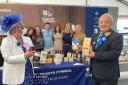Show president Brian Jones MBE and his wife Helen are pictured in the Food Hall sponsored by Mr Jones' company, Castell Howell.