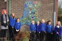 Pupils pictured with ceramic artist, Jody McPartlin, and the new mosaic.