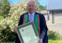 Tom Jones, from Dolanog, with his honourary fellowship from Aberystwyth University.
