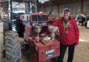 Mr Watkin with some of his many trophies for his competitive ploughing.