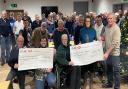 Mid Wales Vintage Machinery Club members presenting cheques to chosen charities.