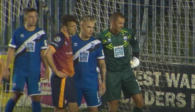 Ben Fawcett, Corey Shepard and keeper Lee Idzi defend a Cardiff Met corner.