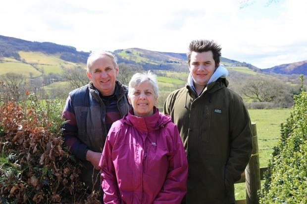 Rob Lewis of Glanelan Farm, Rhayader, pictured with his wife Audrey and son Rhys 12 months after Rob was badly injured by a newly-calved cow.