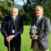 Forestry ‘change maker’ Paul Raymond-Barker BEM, left, receives the Sylva Trophy 2021  from RFS South Wales Division chair Chris Jones