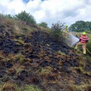 Firefighters from Newtown and Montgomery stations tackle a 70 square metre grass fire on steep farm land near Aberbechan on June 12, 2022. Picture by Montgomery Fire Station @MontyFireSTN