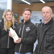 Gareth and Ifan and Ifan’s partner Elin at one of the milk vending sites. Picture: Debbie James