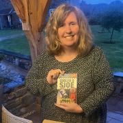 Myfanwy Alexander with her novel Coblyn o Sioe which follows a bizarre case lead by Montgomeryshire  Inspector Daf Dafis at the Royal Welsh Show
