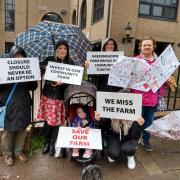 Mum Abigail Davey, pictured second from left, was among those who picketed the council meeting, calling for Greenmeadow Community Farm to be saved from closure. Former staff member Sian Davies, standing far right, was also among them.
