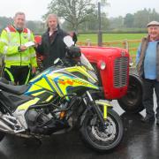 Barry Bevan presenting Steve Bufton with £230 proceeds from the Llanddewi Tractor Run, alongside Gareth Rees, Dennis Davies, Dot Bevan and Joan Davies