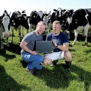 Gareth and Sion Roberts at home on the farm with their NFU Cymru/NFU Mutual Award. Picture: Peter Williams