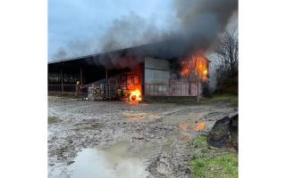 A section of the large barn was on fire.