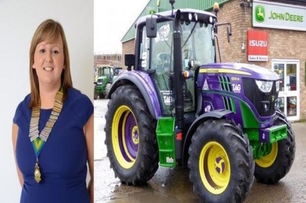 Wales YFC Chairman Vicky Hope and the purple John Deere tractor supplied by Tallis Amos Group.  (52901834)